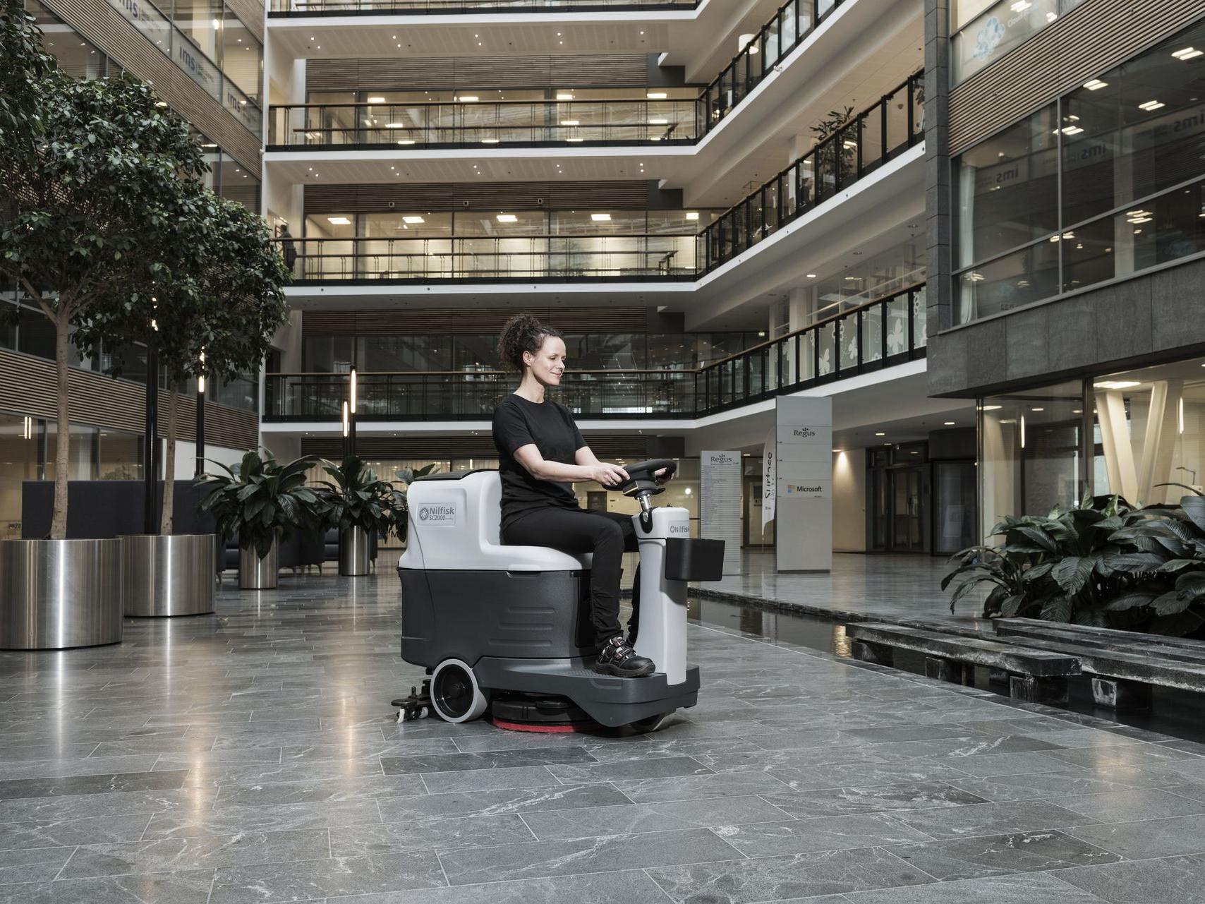 Professional floor scrubber operating inside a government office 