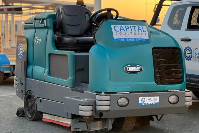 Tennant T20 scrubber used for terminal floor cleaning in busy airport environments